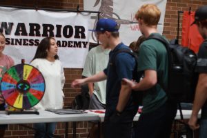 Students visit the Warrior Business Academy table at Club Rush on Aug. 26. Photo by Ty Edwards
