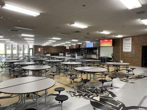 The school cafeteria with added tables to accommodate extra students during the new one lunch period.