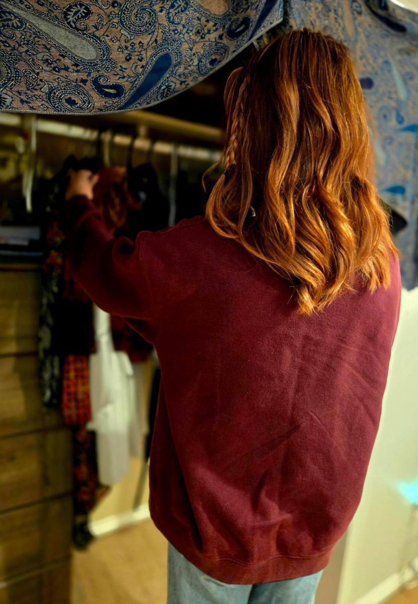 Junior Ainsley Stueve goes through her closet. Provided Photo