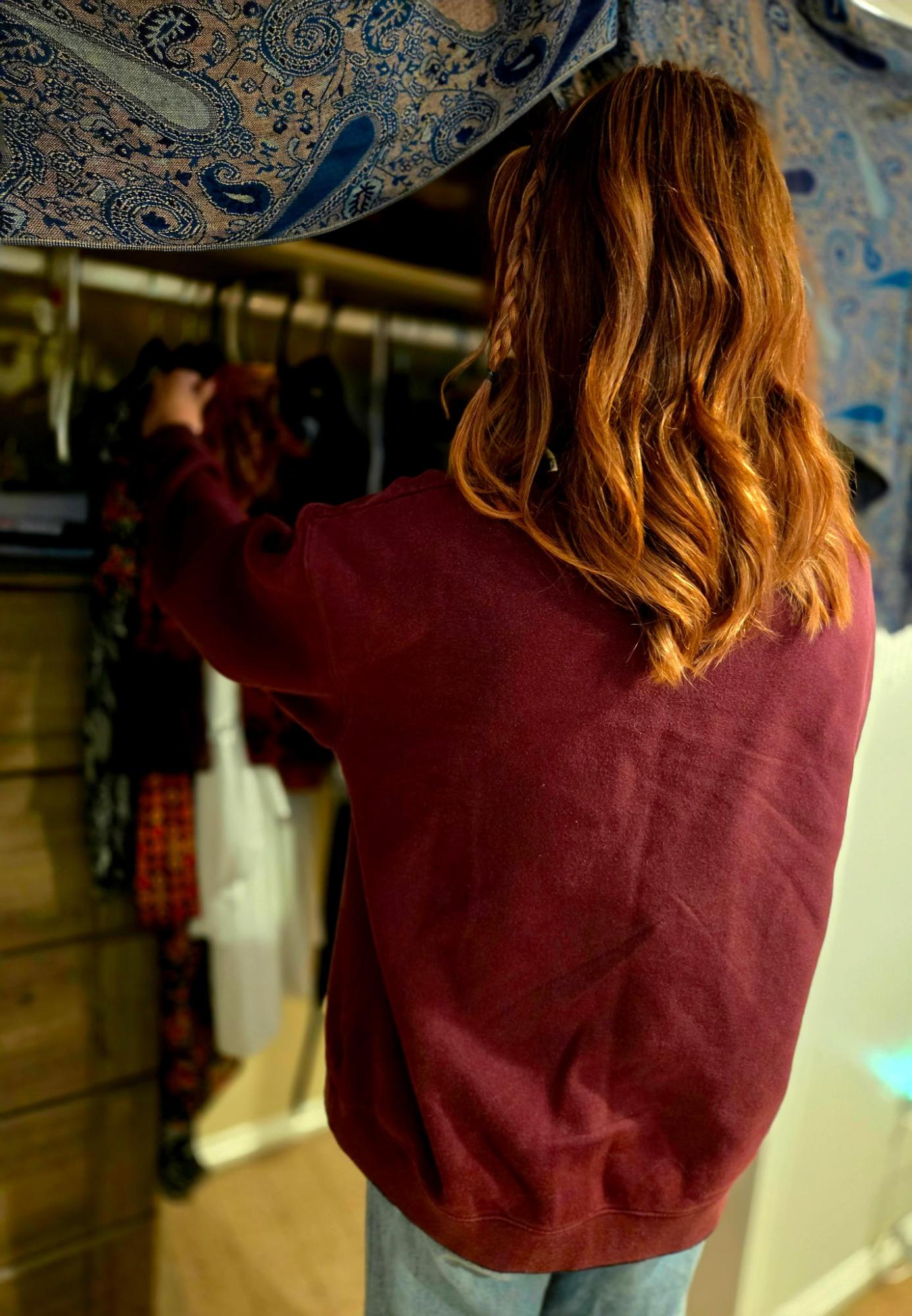 Junior Ainsley Stueve goes through her closet. Provided Photo